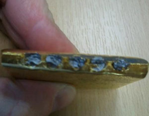 Tampered gold bar