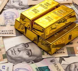 Gold on Top of Urkrainian Money